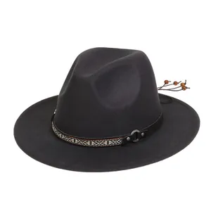 Detail of dark grey felt jazz hat featuring ethnic woven band and silver metal rings
