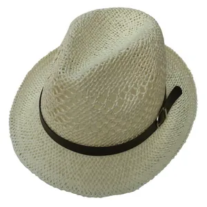 Detail view of woven straw fedora hat featuring a brown leather strap and metal buckle