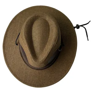 Detail of dark brown straw sun hat featuring breathable mesh crown and windproof chin strap