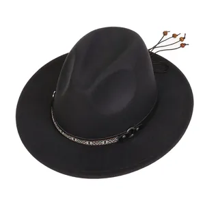 Detail of black wool fedora featuring ethnic geometric band and wooden beads decoration