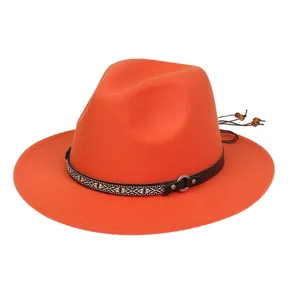 Detail of orange wool fedora featuring a leather strap and woven bohemian pattern belt