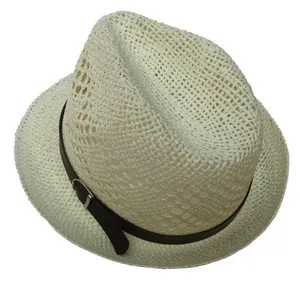 Detail showing the white woven straw texture and dark brown leather band with silver buckle