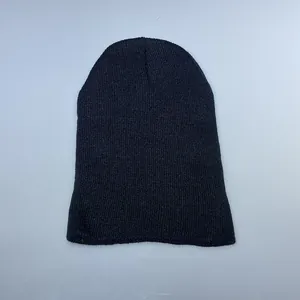 Close-up of a plain black knitted beanie showing fine stitch texture and material detail