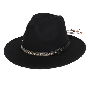 Detail of black wool fedora featuring ethnic woven band and hanging wooden beads
