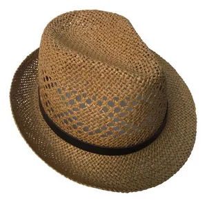 Detail of woven straw fedora hat featuring breathable hollow patterns and leather band