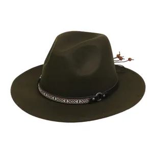 Detail of olive wool fedora featuring ethnic woven band and silver studded leather strap