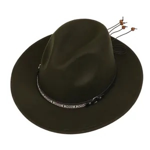 Detail of olive green fedora hat featuring ethnic woven band and wooden bead tassels