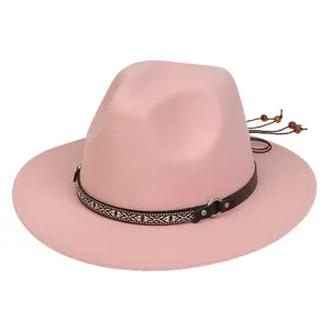 Close-up of pink wool fedora hat with geometric ethnic band and metal ring detail