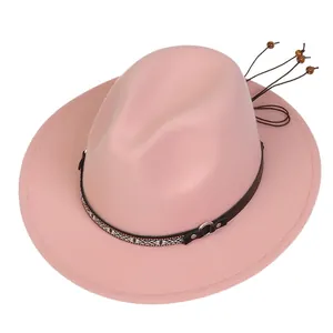 Detail of pink wool fedora featuring ethnic band, metal buckle and wooden beads