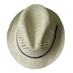 Detailed top view of ivory straw jazz hat with breathable weave and black buckle band