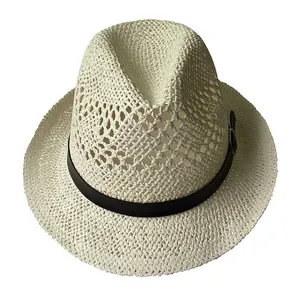 Detail of breathable straw sun hat featuring coarse hollow weave and black leather buckle