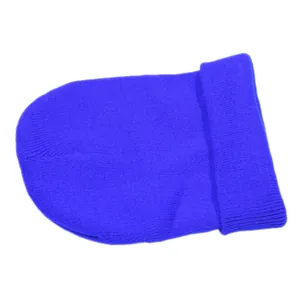 Close-up of royal blue cuffed beanie showing fine knit texture and stretchy fabric