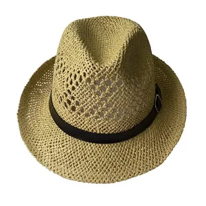Detail of khaki straw fedora featuring a dark brown band and silver metal buckle