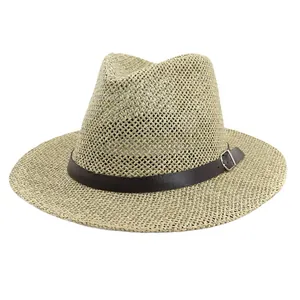 Neutral Panama straw sun hat with deep brown leather band and metallic buckle detail
