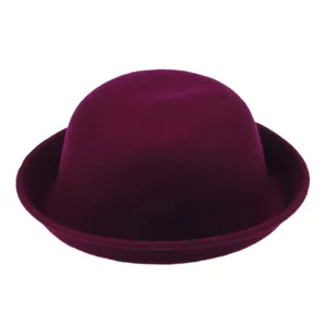 Detail of the curled brim and smooth felt texture of this elegant purple dome hat