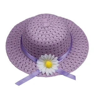 Detail of light purple straw hat featuring a silk ribbon and white daisy flower decoration