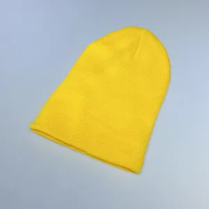 Detailed view of the fine knit texture and ribbed edge of the yellow winter beanie
