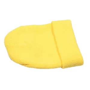 Detailed view of the ribbed knit texture on a bright yellow cuffed beanie hat