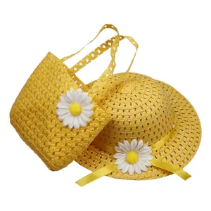 Detail of yellow straw sun hat and matching sunflower handbag set for toddlers