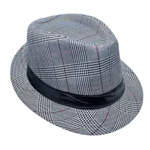 Detail of classic houndstooth fedora hat with black satin band and red stitching accents