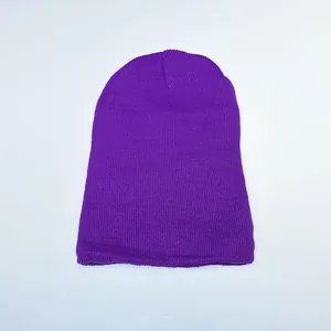 Close-up of a purple knitted beanie showing dense flat-knit texture and soft wool blend fabric
