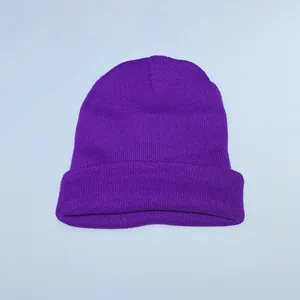 Detailed close-up showing the elastic knit texture of this bright purple winter beanie hat