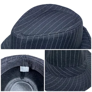 Detail of the washing label showing 35% cotton and 65% polyester fabric blend on fedora hat