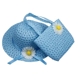 Kids sky blue straw sun hat and matching floral handbag set with daisy flowers