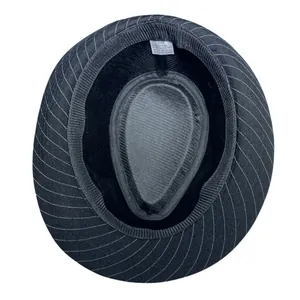 Detail view of inner fedora lining with size tag showing 35% cotton 65% polyester material