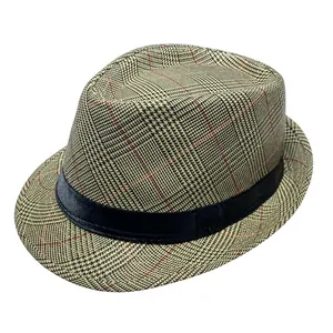 Detail of British plaid jazz hat featuring brown glen check pattern and black satin ribbon