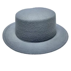 Detailed texture of dark grey wool felt flat top fedora hat with a wide brim