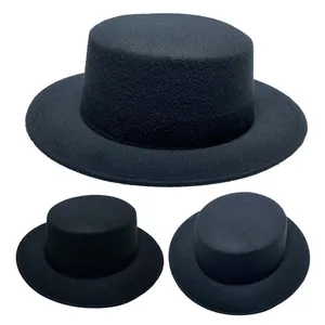 Detailed macro view of black wool felt texture on a flat top wide brim fedora hat