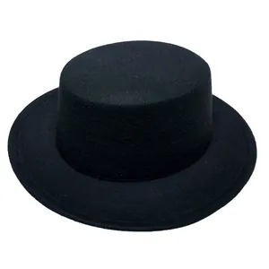 Detail view of a black flat top wool felt boater hat with a wide straight brim