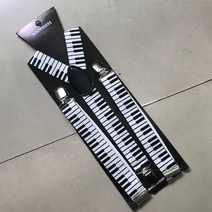 Detail of piano key pattern suspenders with silver metal clips and black leather joiner