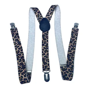 Detail view of leopard print Y-back suspenders with metal clips and leather patch