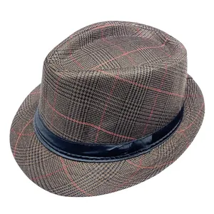 Close-up of brown plaid fedora hat with red check lines and a black ribbon band