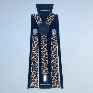 Detail of leopard print elastic suspender with silver metal clips on a display card