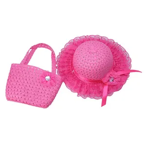 Detailed view of pink straw hat and matching handbag set with lace flower decorations