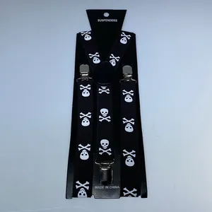 Detail of black suspenders with white skull print and heavy-duty silver metal clips