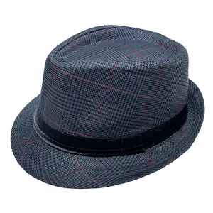 Close-up of gray plaid fedora hat with black satin ribbon and subtle red stitching
