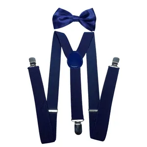 Detail of dark blue elastic Y-back suspenders with matching bow tie and silver metal clips