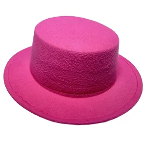 Detailed top view of a hot pink wool felt flat top hat showing texture and stitching