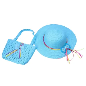 Close-up of bright blue straw hat and handbag set with colorful ribbon and pearl bows