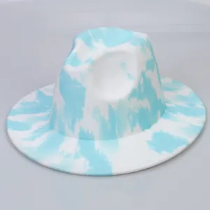 Close-up of blue and white tie-dye wool fedora hat with a wide brim and textured finish