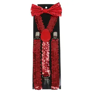 Macro detail of red sequined bowtie and adjustable suspenders for festive costumes