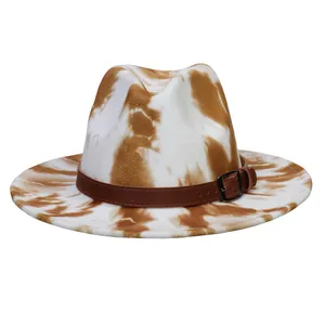 Detail view of the brown leather decorative belt and metal buckle on tie-dye fedora