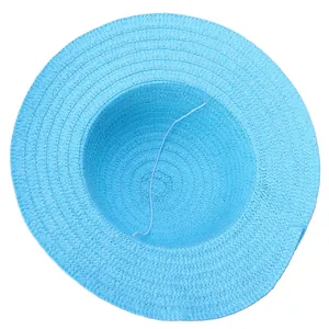 Detail view of woven straw hat interior with elastic chin strap and textured brim
