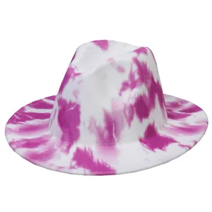 Detailed view of pink and white tie-dye fedora hat with a wide brim and wool texture