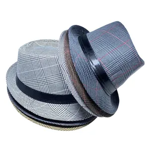 Detailed stack of men's vintage plaid fedora hats with black faux leather bands