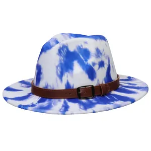 Detail of blue and white tie-dye fedora hat with a leather belt and silver buckle